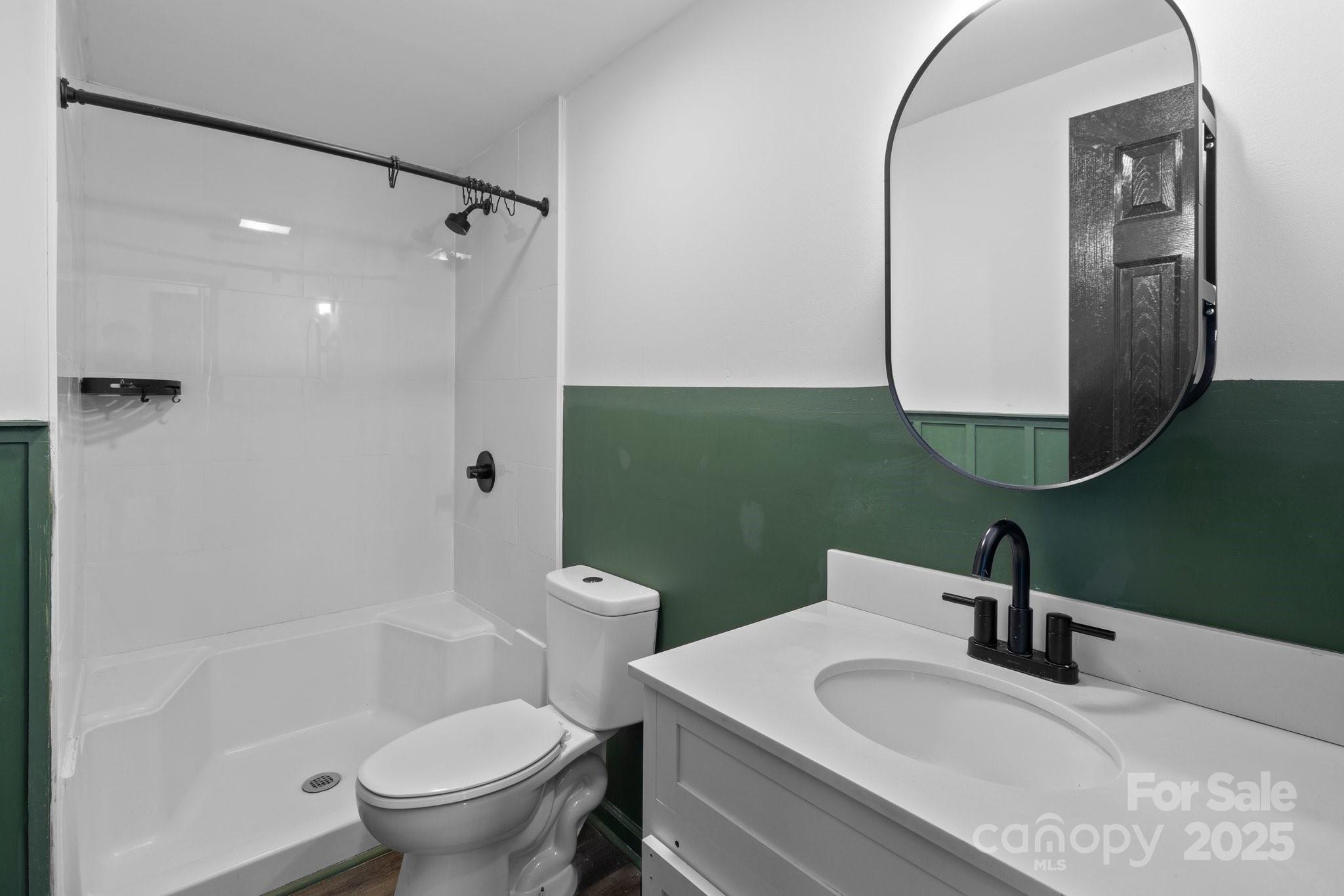 4642 McClure Road Charlotte, NC 28216 - Photo 34 of 48 a bathroom with a sink toilet and shower