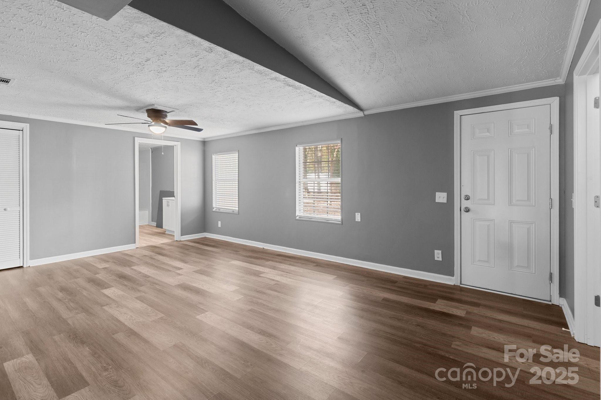 4642 McClure Road Charlotte, NC 28216 - Photo 35 of 48 a view of an empty room with wooden floor and a window