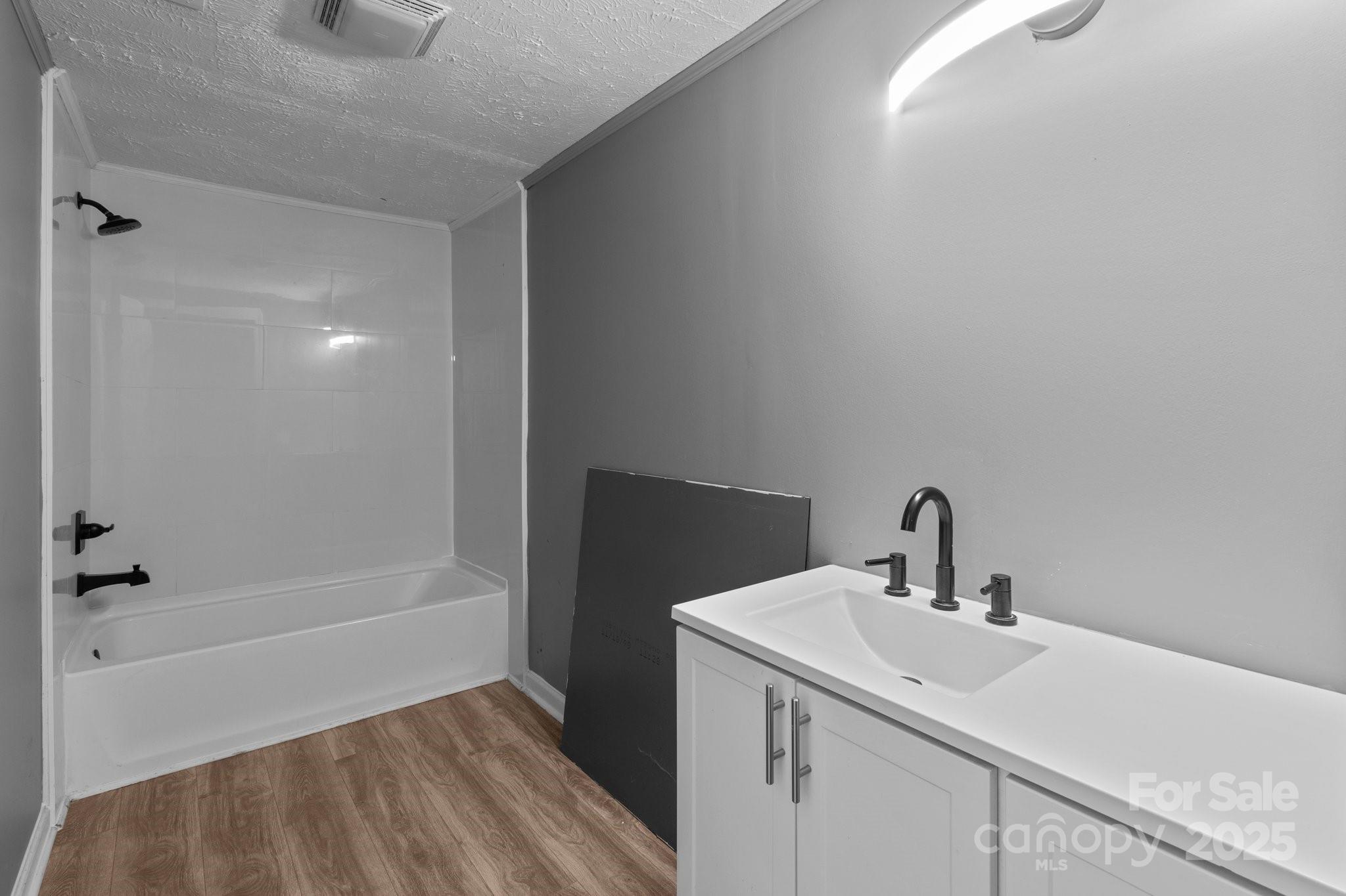 4642 McClure Road Charlotte, NC 28216 - Photo 38 of 48 a bathroom with a sink and a mirror