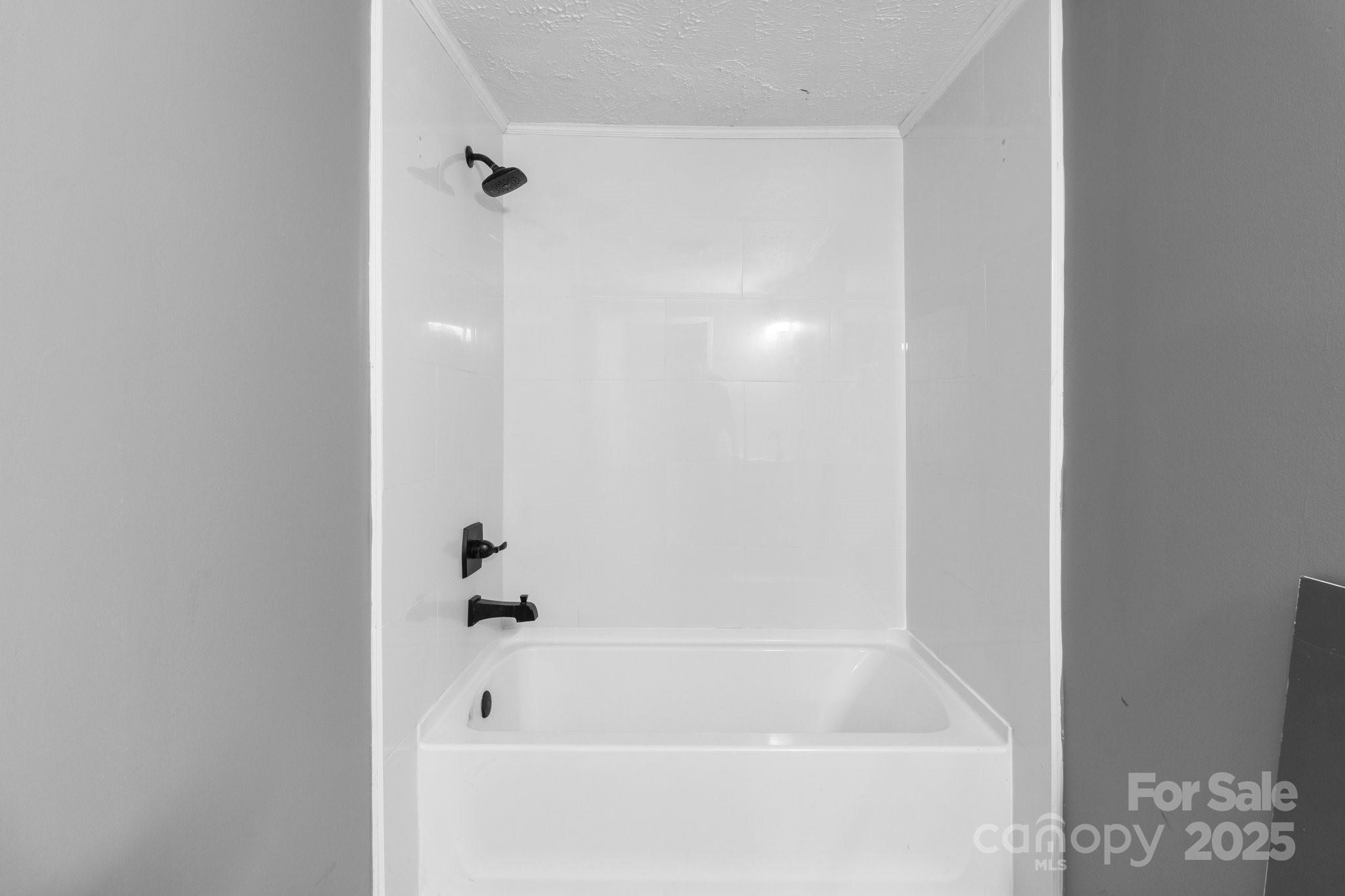 4642 McClure Road Charlotte, NC 28216 - Photo 39 of 48 a close view of a bathtub in bathroom