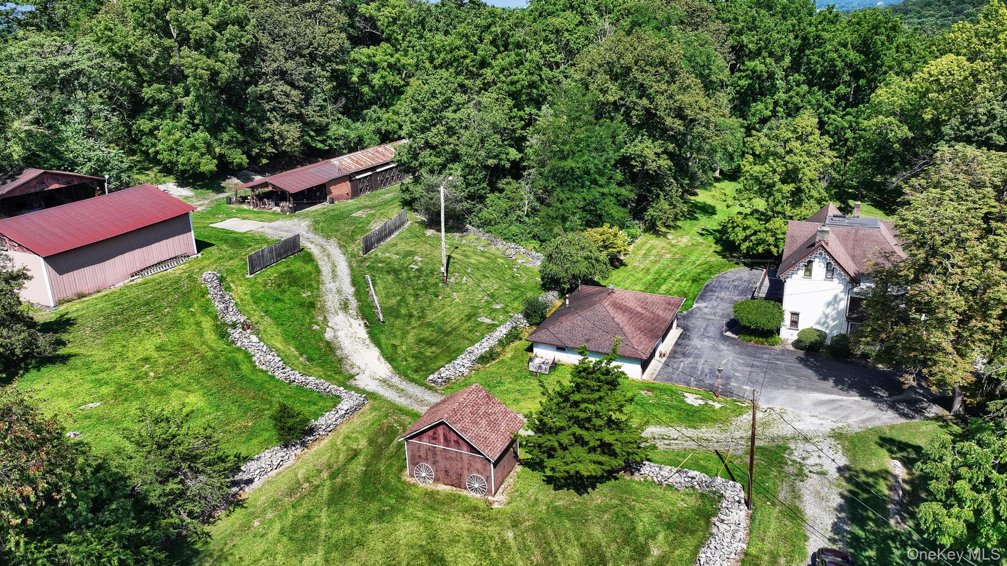 View of subject property featuring a forest