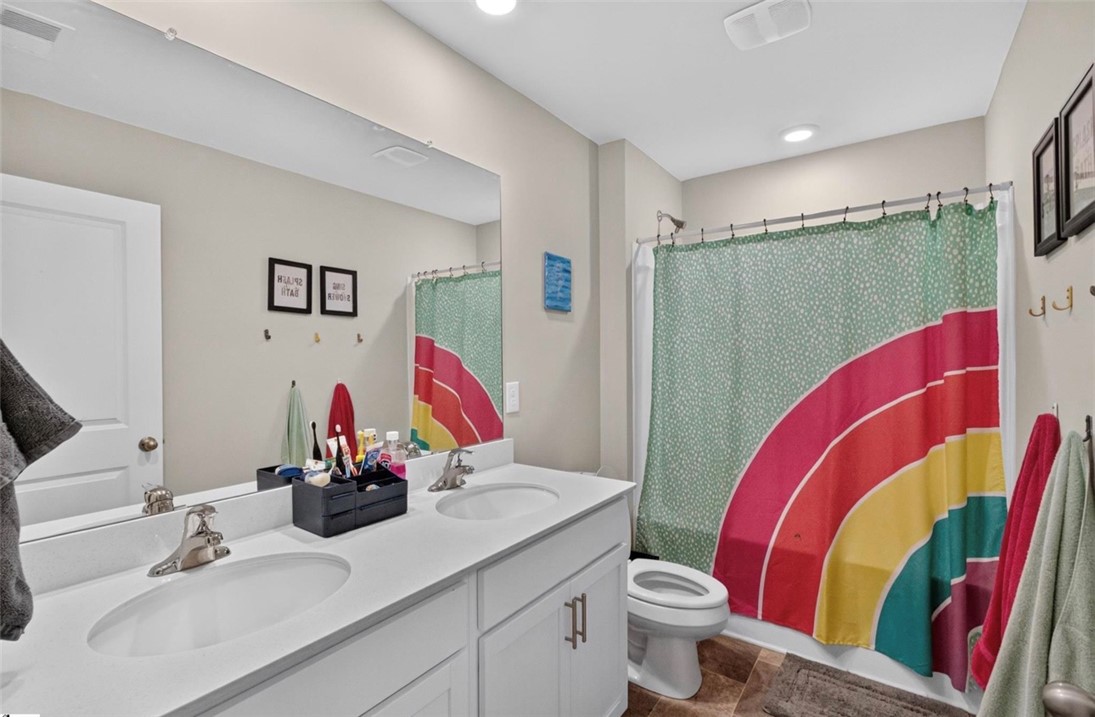 213 Millhone Way Pendleton, SC 29670 - Photo 14 of 25 Dual vanity sinks provide ample space for morning routines in this well-appointed bathroom.