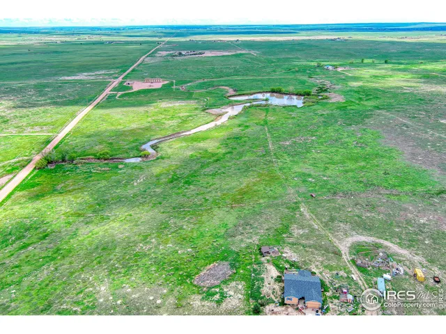 a view of a field with an outdoor space