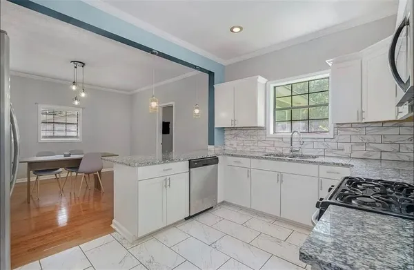 a kitchen with a sink and cabinets