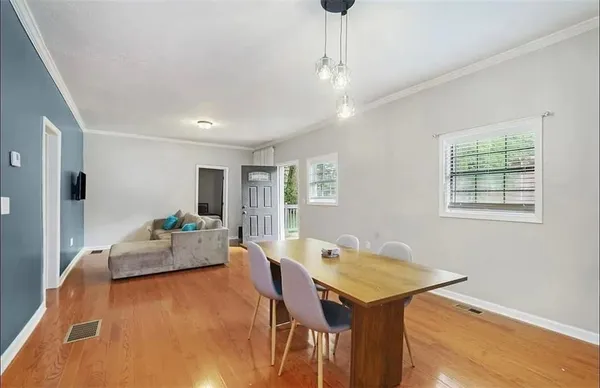 a living room with furniture and a table