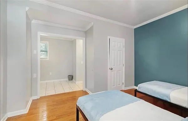 a bedroom with a bed and closet