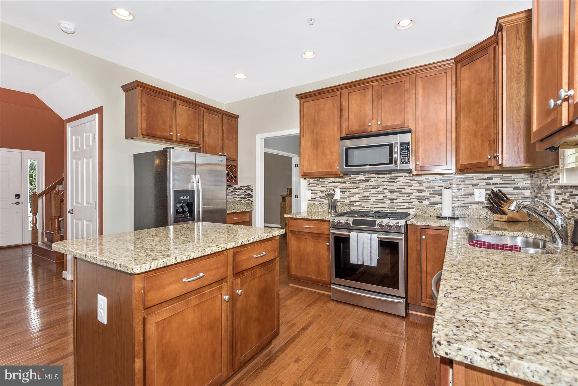4000 Paw Paw Circle Point of Rocks, MD 21777 - Photo 12 of 30 a kitchen with stainless steel appliances granite countertop a stove a sink and a microwave