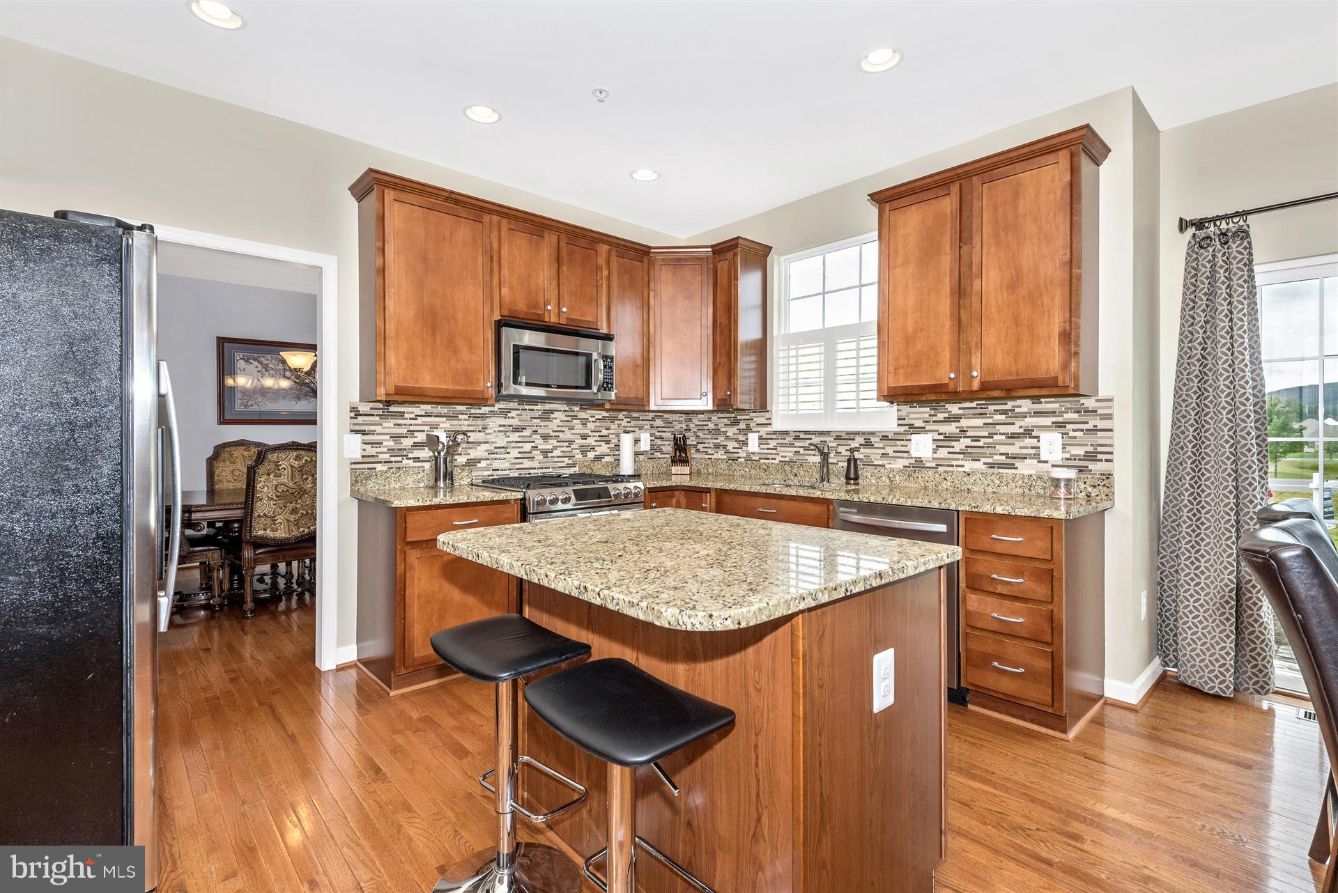 4000 Paw Paw Circle Point of Rocks, MD 21777 - Photo 14 of 30 a kitchen with stainless steel appliances granite countertop counter space a sink and a refrigerator