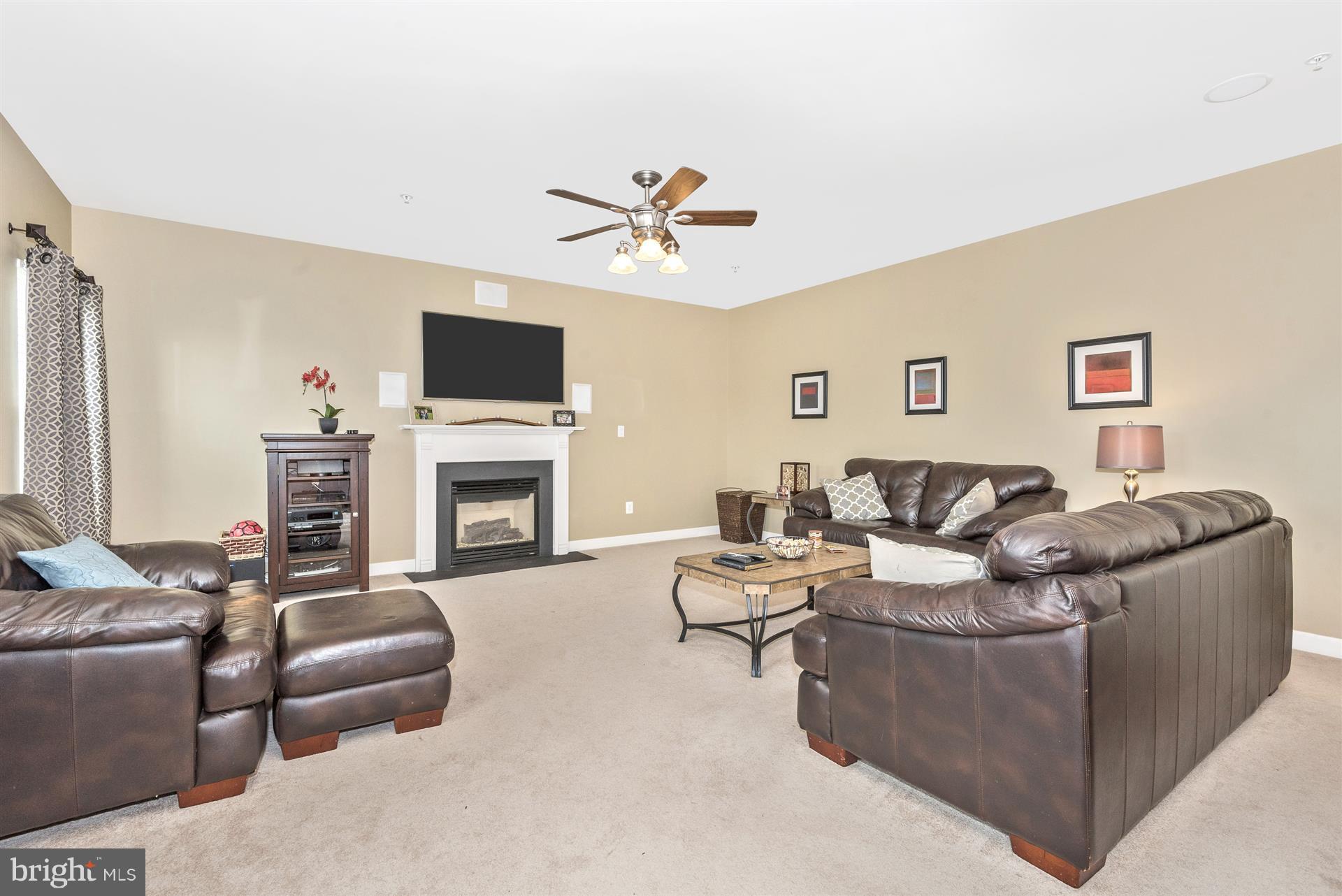4000 Paw Paw Circle Point of Rocks, MD 21777 - Photo 17 of 30 a living room with furniture a flat screen tv and a fireplace