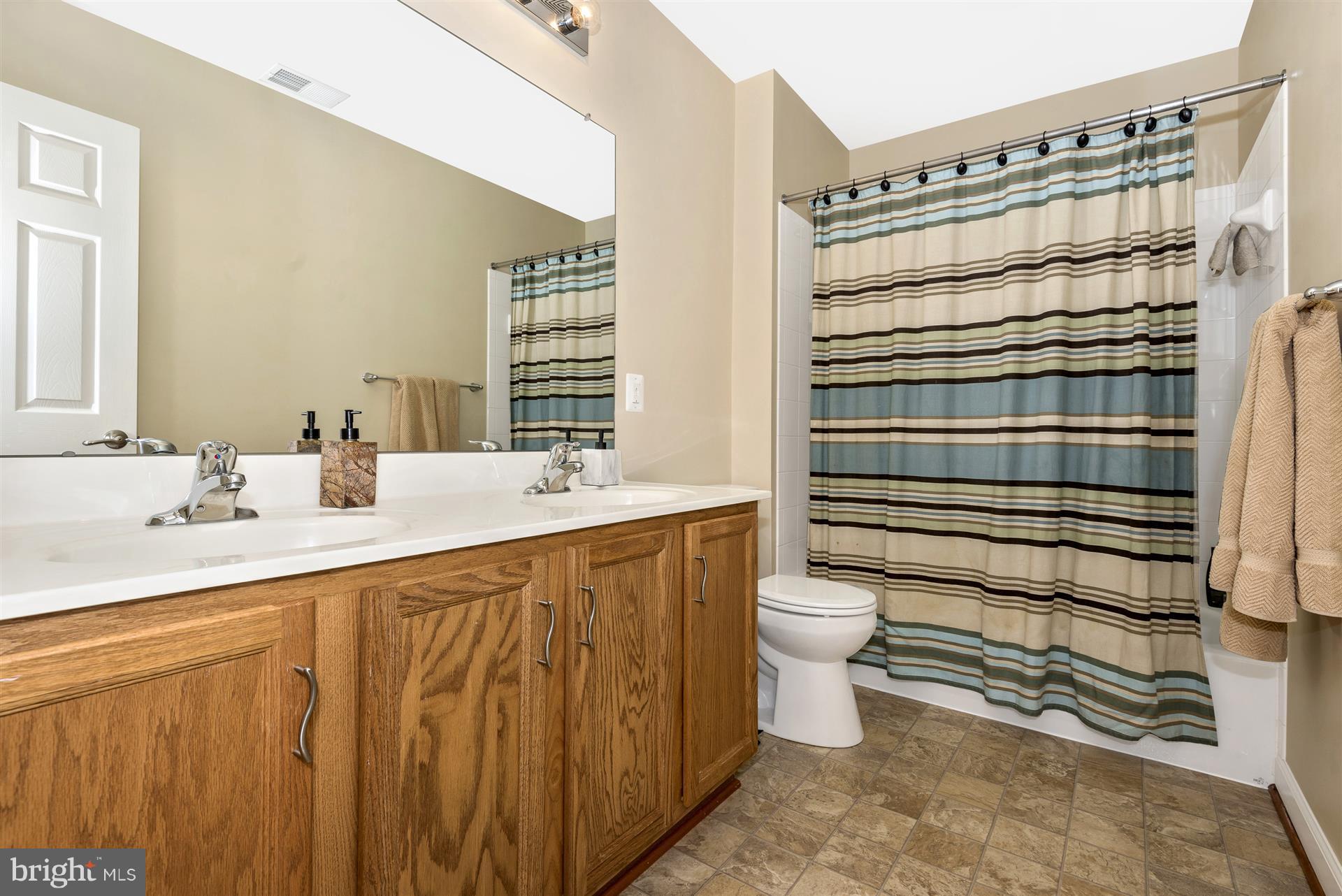 4000 Paw Paw Circle Point of Rocks, MD 21777 - Photo 25 of 30 a bathroom with a double vanity sink toilet and shower