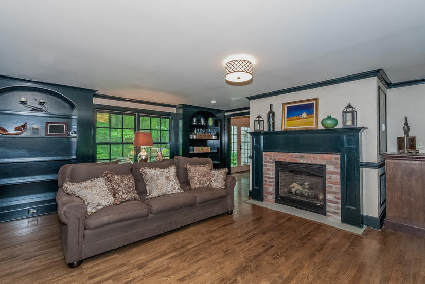 48 Huckleberry Hill Road Wilton, CT 06897 - Photo 6 of 25 a living room with furniture and a fireplace