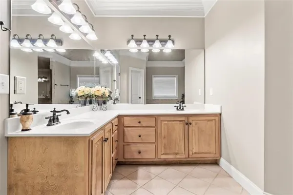 a bathroom with a sink vanity and a mirror