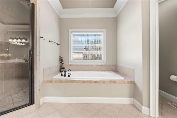 a bathroom with a bathtub and shower