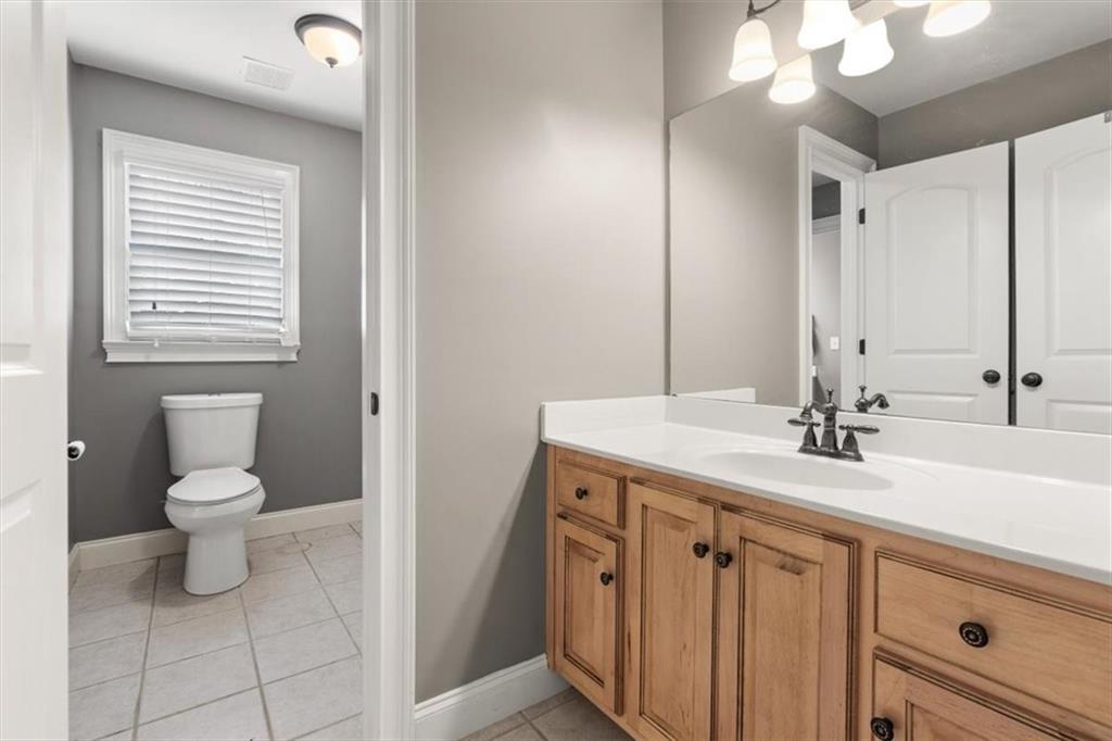 18 Nelson Boulevard Northwest Rome, GA 30165 - Photo 25 of 41 a bathroom with a sink a toilet and a mirror