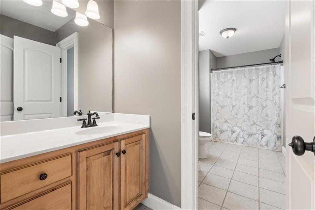 18 Nelson Boulevard Northwest Rome, GA 30165 - Photo 26 of 41 a bathroom with a sink a toilet and shower