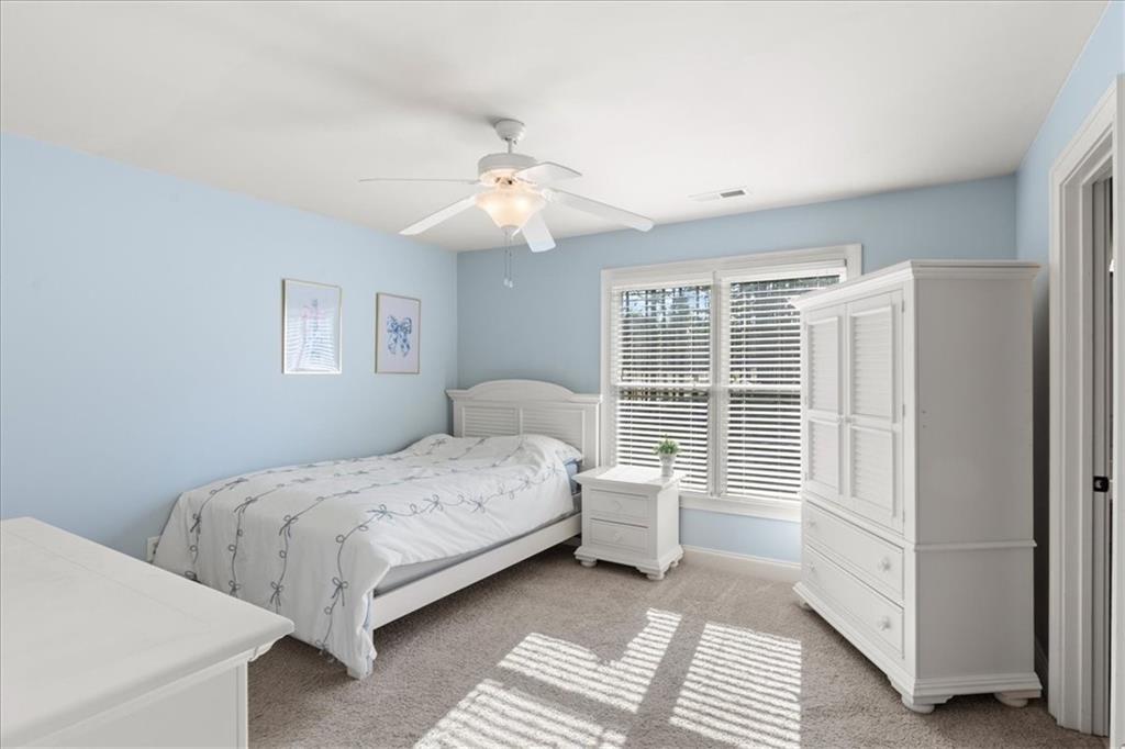 18 Nelson Boulevard Northwest Rome, GA 30165 - Photo 28 of 41 a bedroom with a bed and a large window