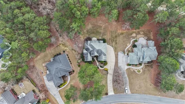 an aerial view of a house with outdoor space