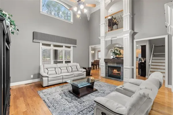 a living room with furniture and a fireplace