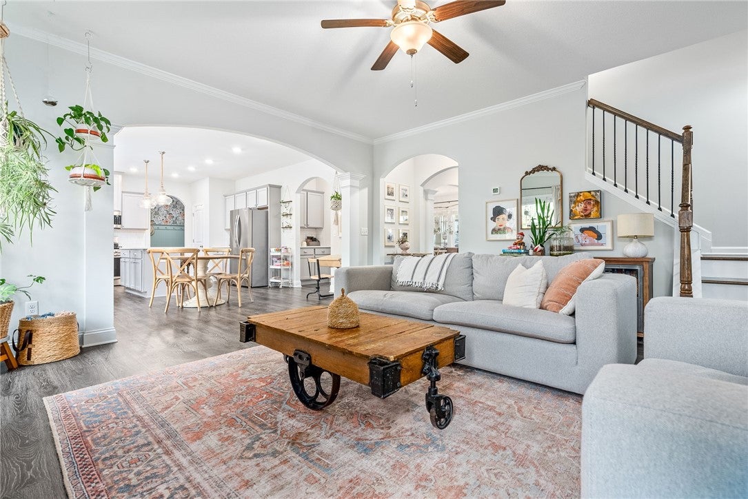 Spacious great room has arched doorways to add character to the room