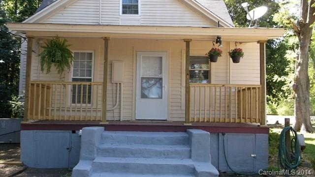 8500 Old Concord Road Charlotte, NC 28213 - Photo 1 of 15 a front view of a house with a garden