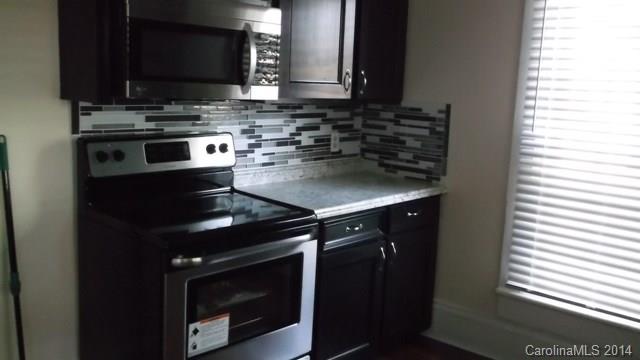 8500 Old Concord Road Charlotte, NC 28213 - Photo 3 of 15 a kitchen with stainless steel appliances a stove and a microwave