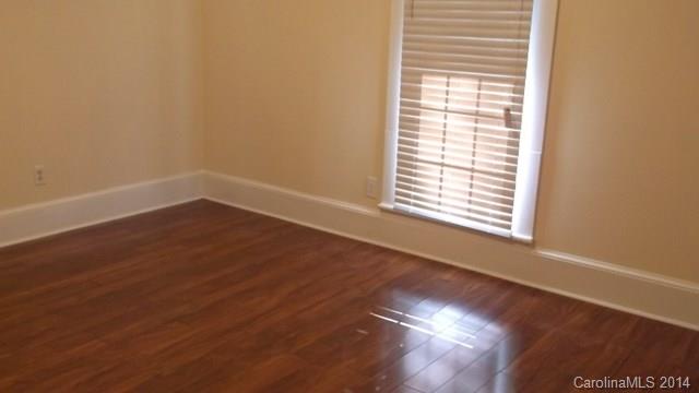 8500 Old Concord Road Charlotte, NC 28213 - Photo 4 of 15 a view of an empty room with wooden floor and a window