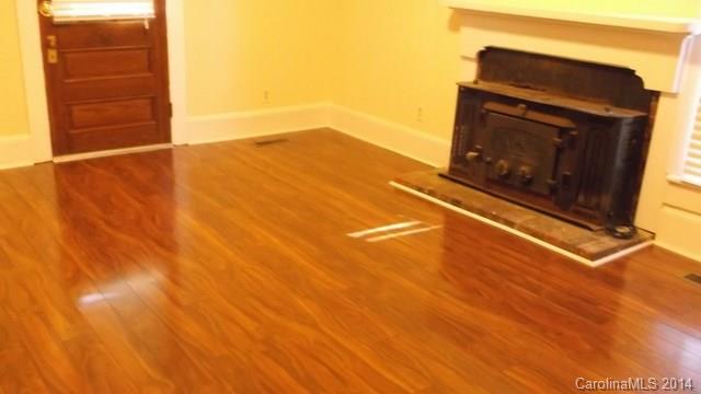 8500 Old Concord Road Charlotte, NC 28213 - Photo 5 of 15 a view of empty room with wooden floor and fan