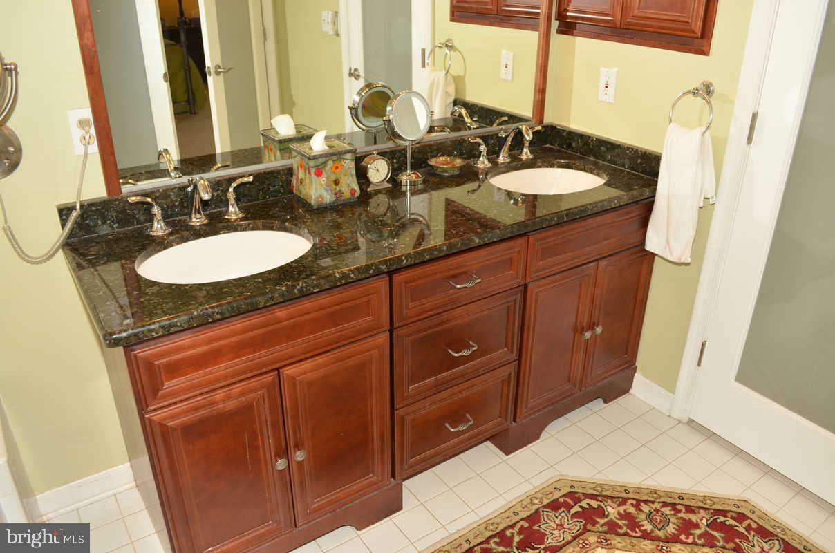 1465 Old Hickory Road Annapolis, MD 21409 - Photo 20 of 30 a bathroom with a granite countertop sink and a mirror