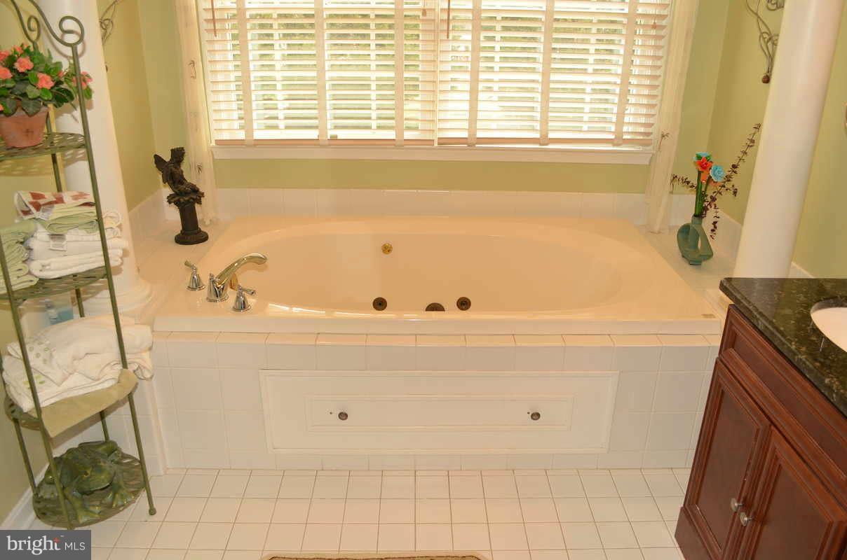 1465 Old Hickory Road Annapolis, MD 21409 - Photo 21 of 30 a bath tub sitting next to a window