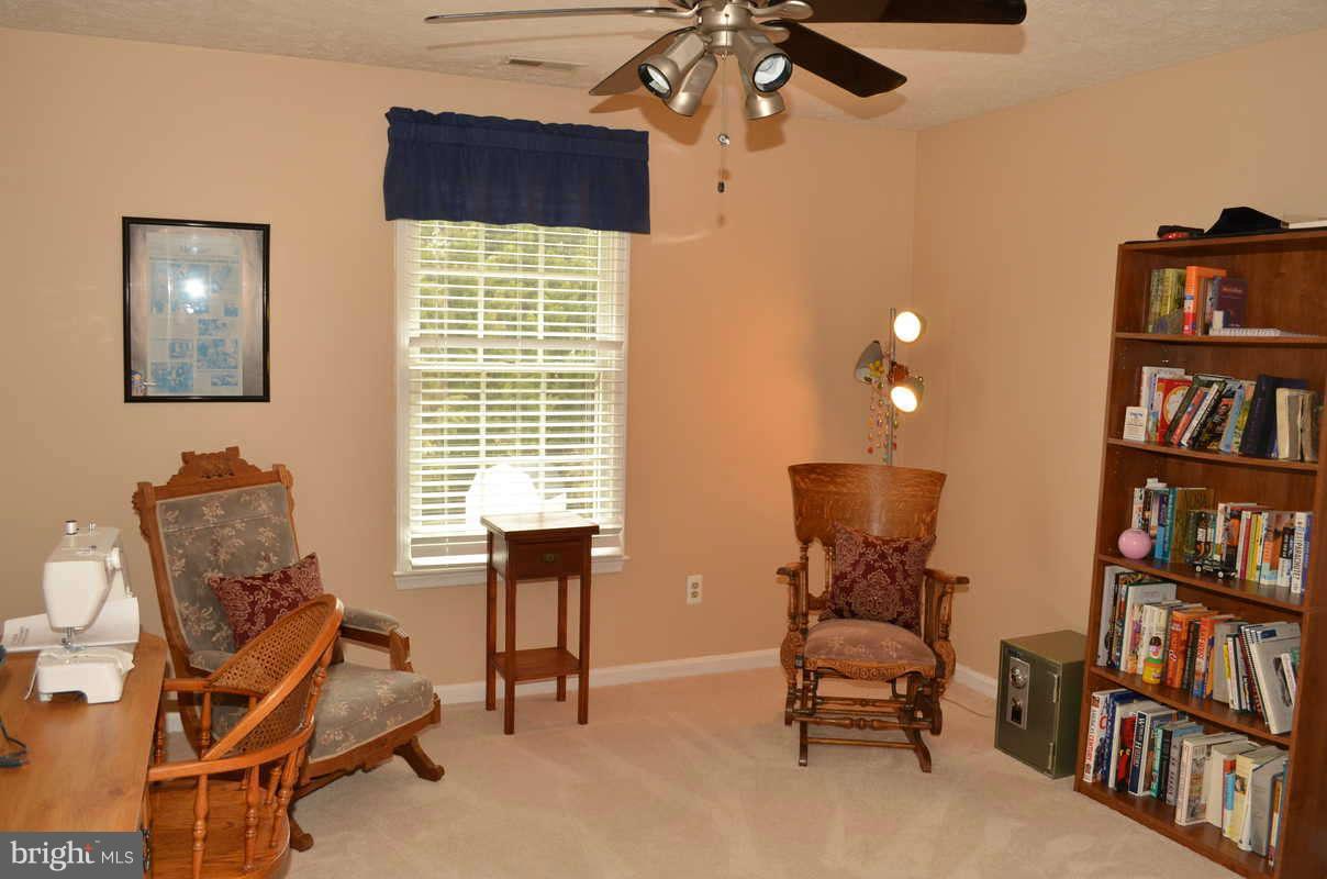 1465 Old Hickory Road Annapolis, MD 21409 - Photo 23 of 30 a living room with furniture and a book shelf