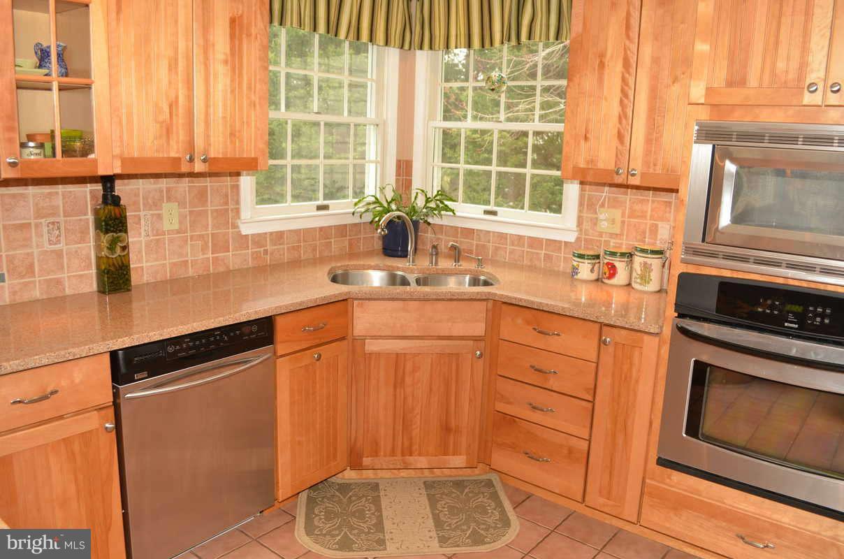 1465 Old Hickory Road Annapolis, MD 21409 - Photo 4 of 30 a kitchen with granite countertop a sink cabinets stainless steel appliances and a window