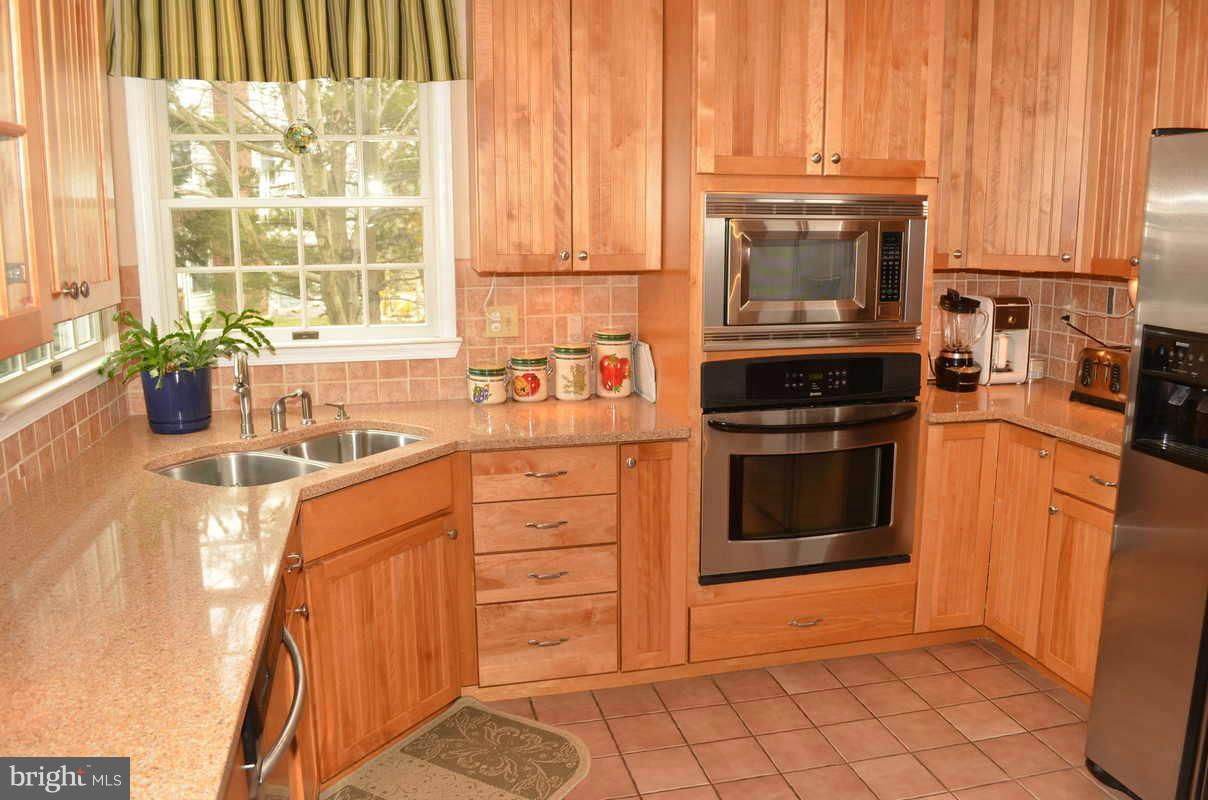 1465 Old Hickory Road Annapolis, MD 21409 - Photo 5 of 30 a kitchen with stainless steel appliances a stove sink and cabinets