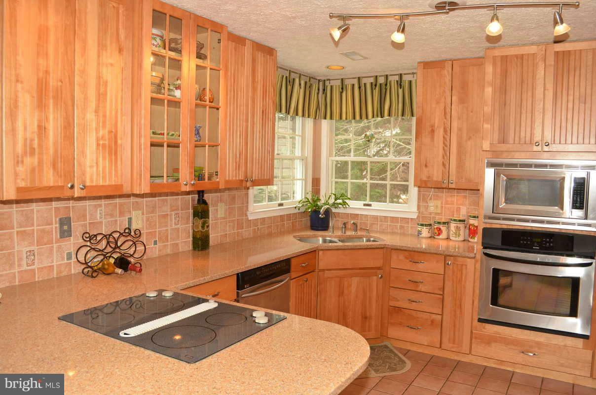 1465 Old Hickory Road Annapolis, MD 21409 - Photo 6 of 30 a kitchen with stainless steel appliances a sink a stove and a refrigerator