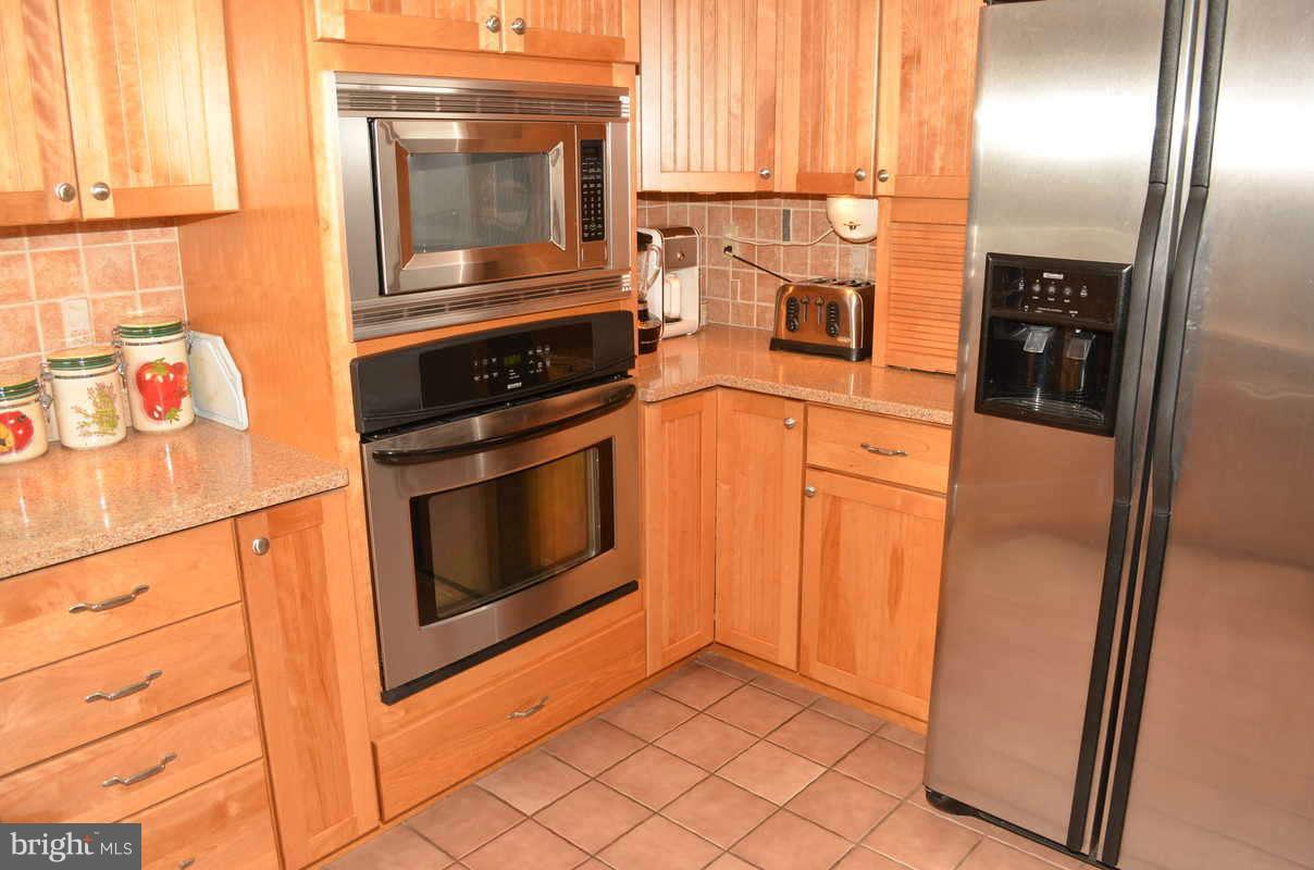 1465 Old Hickory Road Annapolis, MD 21409 - Photo 7 of 30 a kitchen with granite countertop cabinets and steel stainless steel appliances