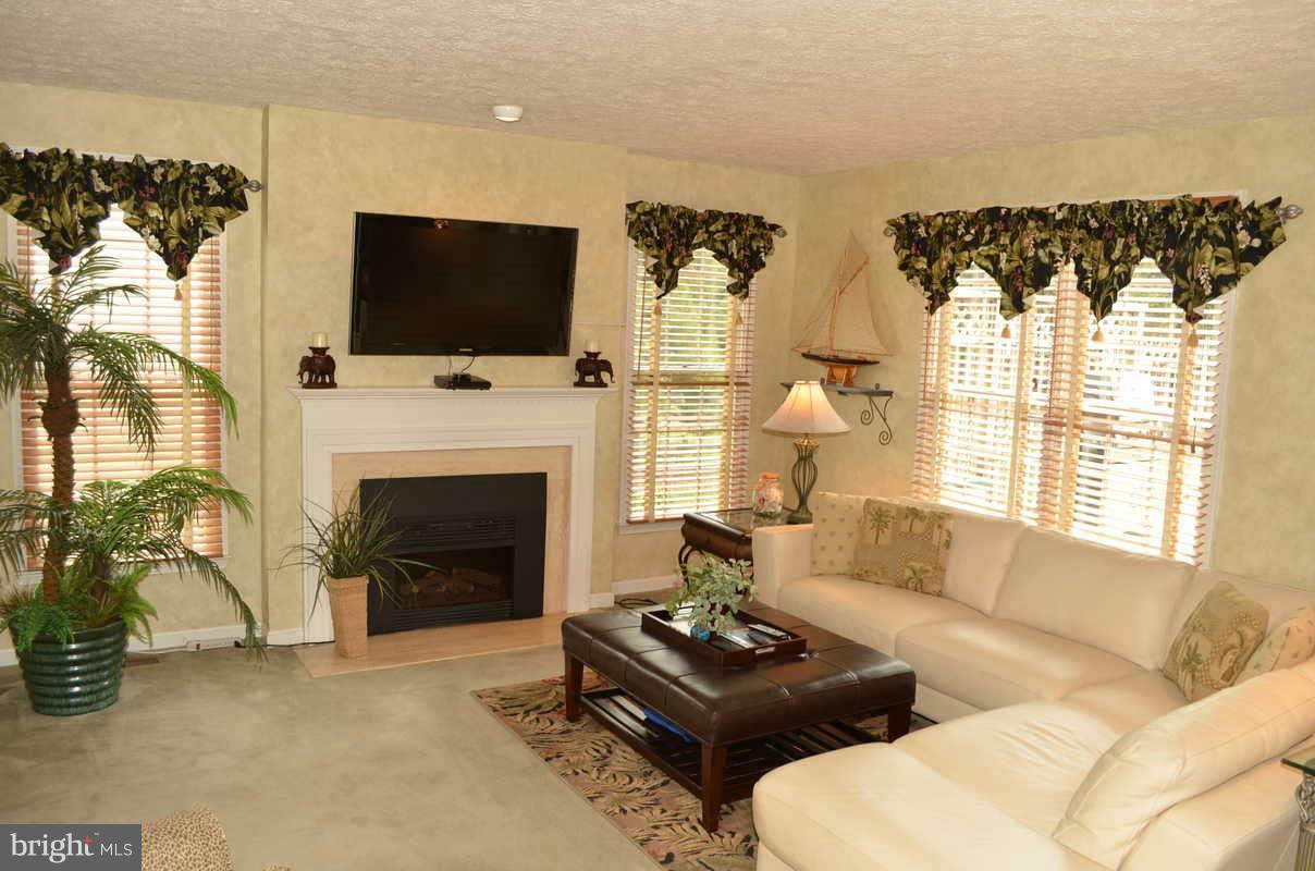 1465 Old Hickory Road Annapolis, MD 21409 - Photo 10 of 30 a living room with furniture fireplace and flat screen tv