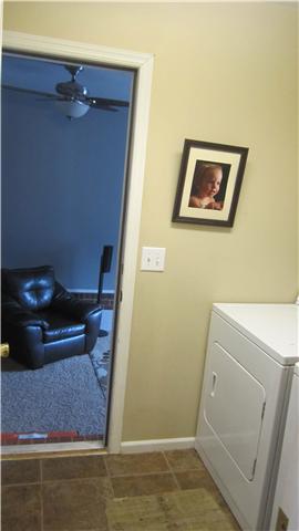 607 Terrace Hill Road Mount Juliet, TN 37122 - Photo 15 of 20 Laundry Room leads to Rec Room. Owner kept the exterior door to minimize the sound traveling into the rest of the house.