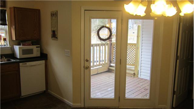 607 Terrace Hill Road Mount Juliet, TN 37122 - Photo 7 of 20 Enjoy the outdoors right outside your Kitchen door - covered porch ideal for watching the kids place in the pool.