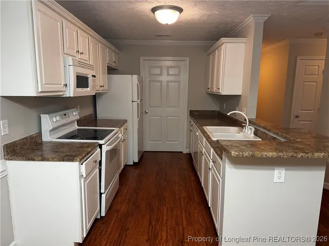a kitchen with stainless steel appliances granite countertop a stove and a sink