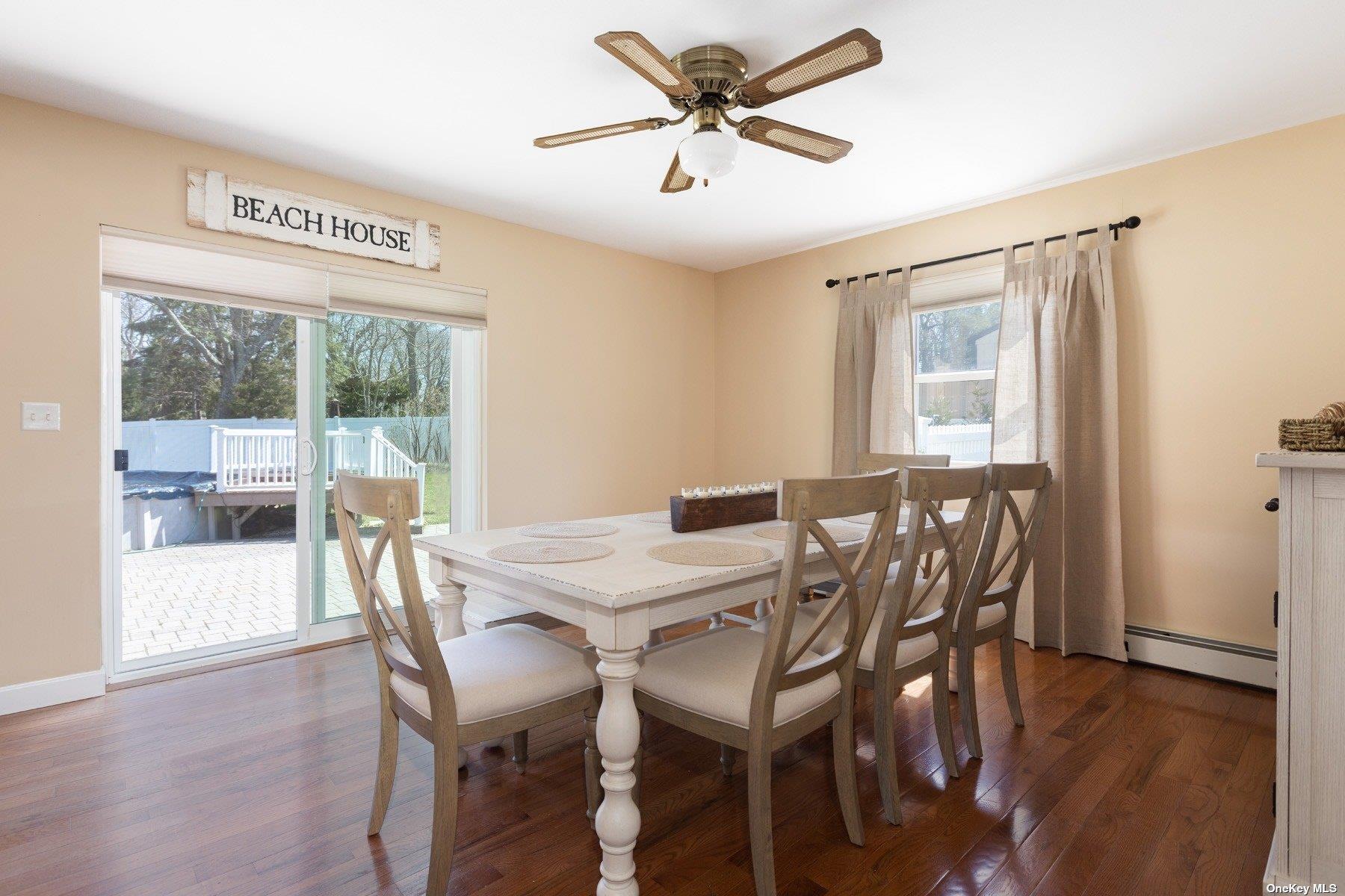 400 Wells Road Laurel, NY 11948 - Photo 4 of 17 a view of a dining room with furniture window and wooden floor