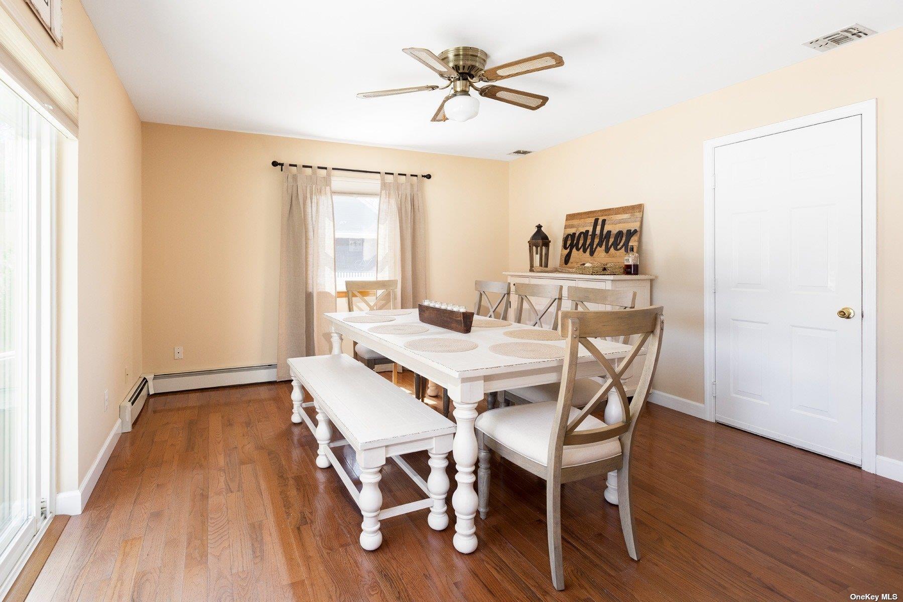 400 Wells Road Laurel, NY 11948 - Photo 5 of 17 a view of a dining room with furniture and wooden floor