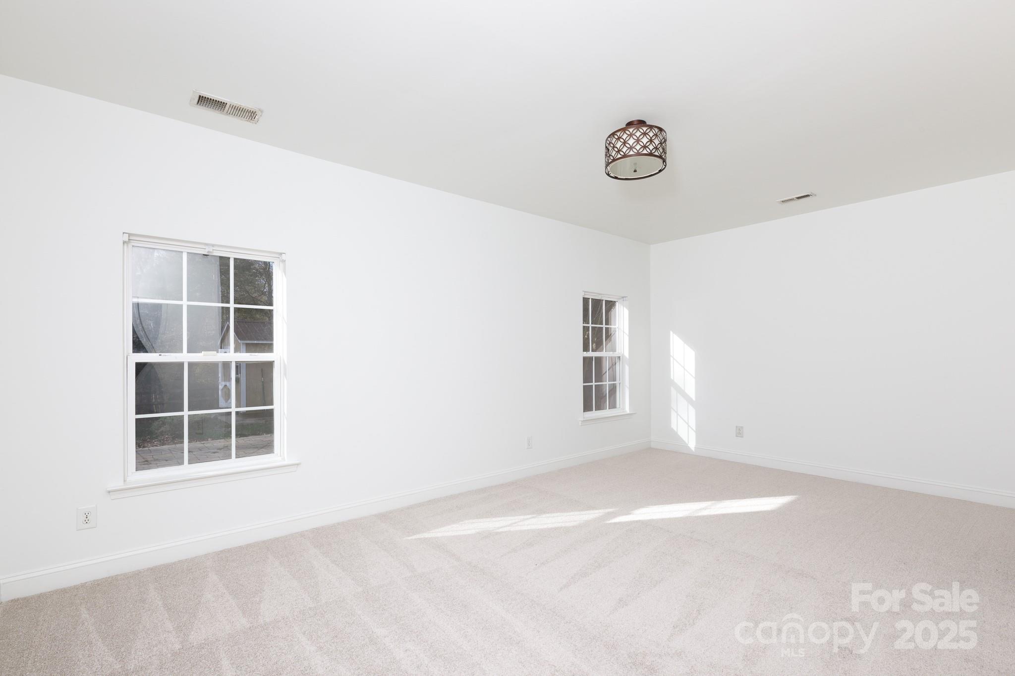 780 Ivy Trail Way Fort Mill, SC 29715 - Photo 6 of 14 an empty room with windows