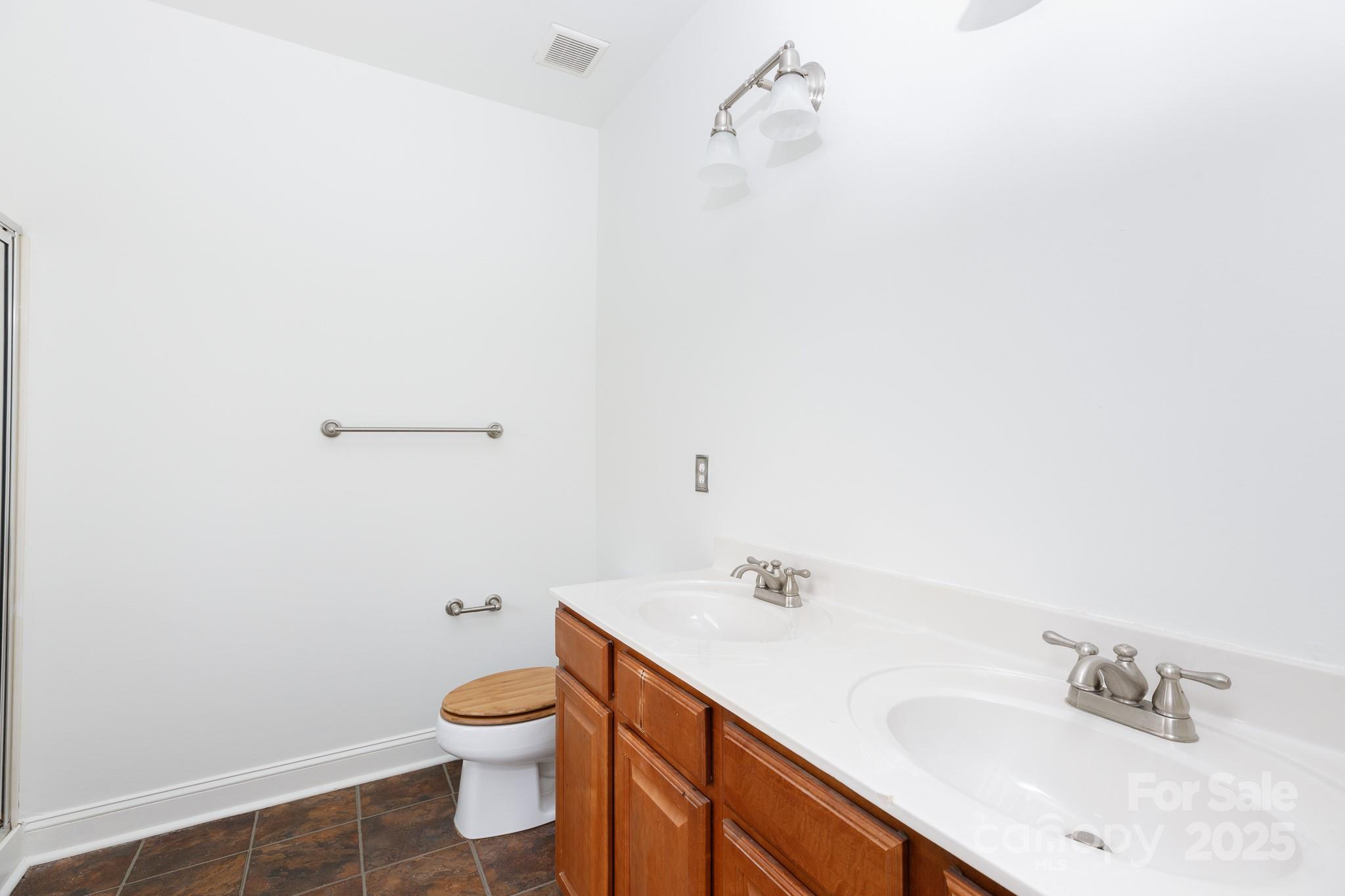 780 Ivy Trail Way Fort Mill, SC 29715 - Photo 7 of 14 a bathroom with a sink a toilet and a mirror