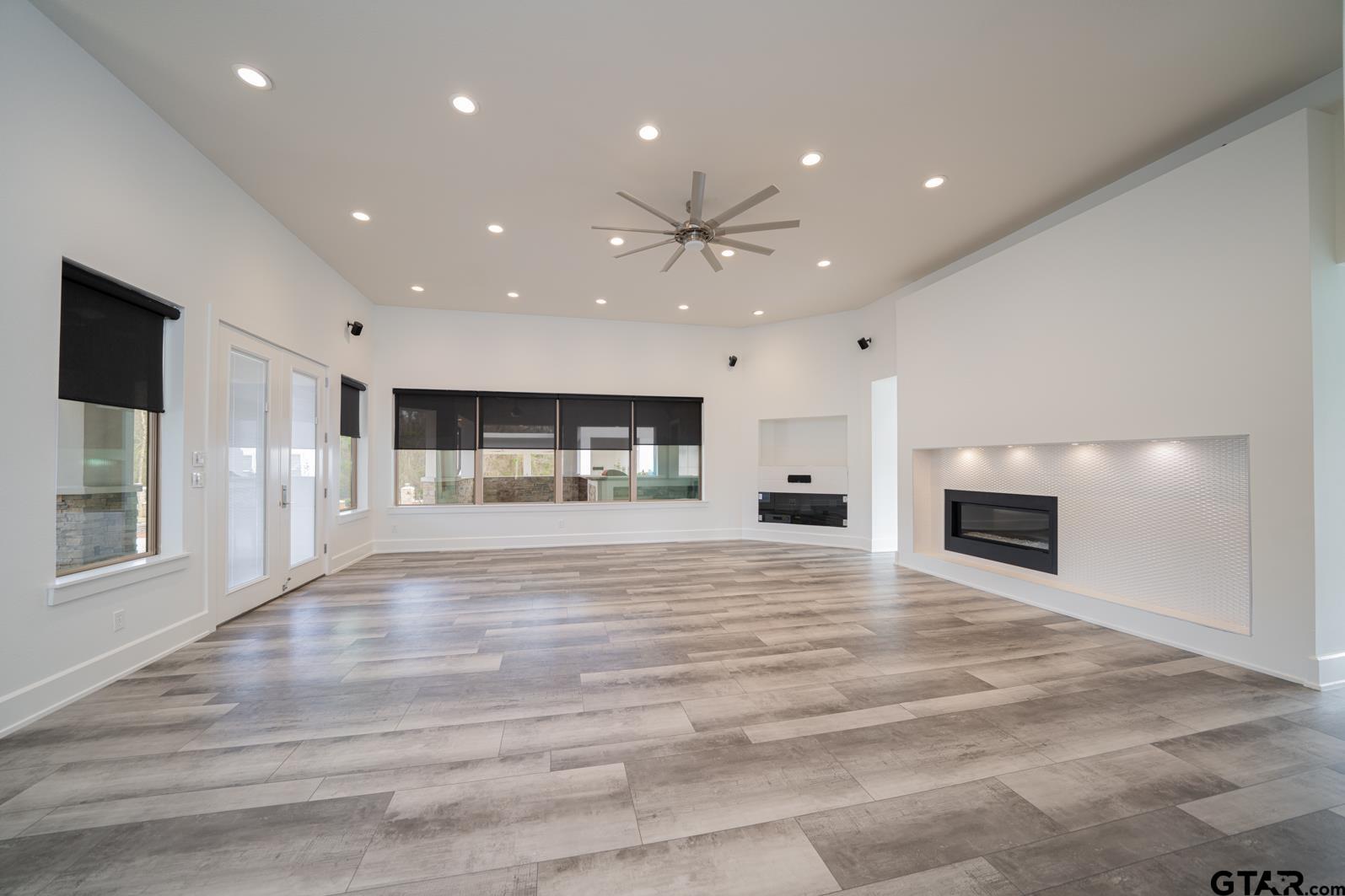 8 Stonebridge Court Longview, TX 75605 - Photo 11 of 48 a view of an empty room with a fireplace and window