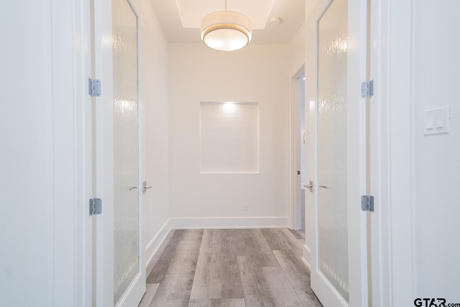 8 Stonebridge Court Longview, TX 75605 - Photo 19 of 48 a view of a room with wooden floor