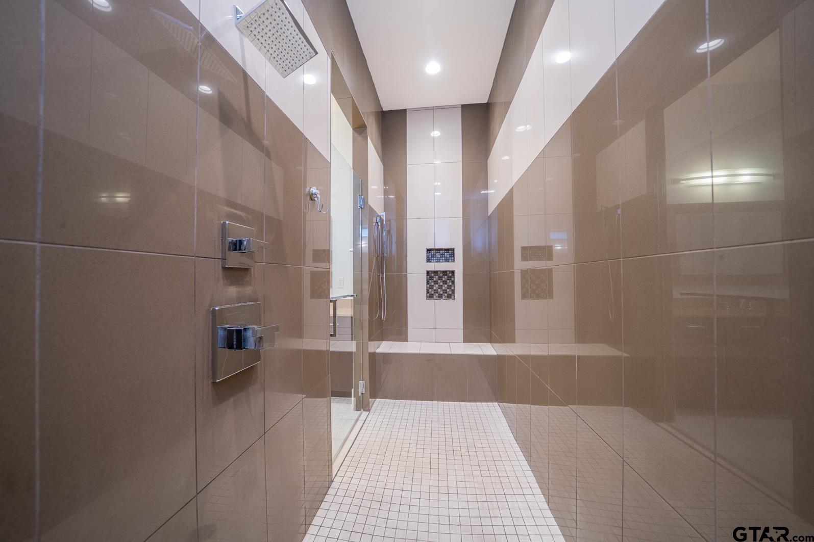 8 Stonebridge Court Longview, TX 75605 - Photo 25 of 48 a bathroom with a glass door shower