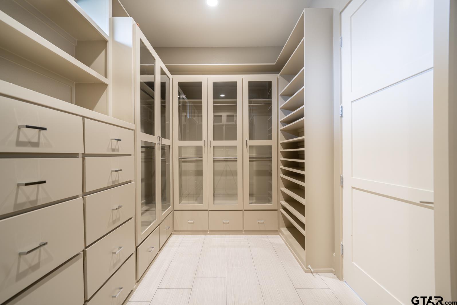8 Stonebridge Court Longview, TX 75605 - Photo 26 of 48 a view of walk in closet with empty racks
