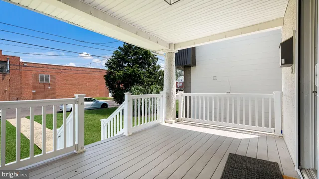 a view of a balcony with wooden floor