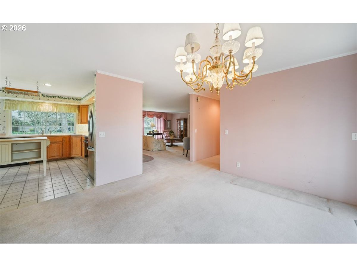 1376 Brickley Road Eugene, OR 97401 - Photo 19 of 48 a view of a room with a chandelier and fireplace