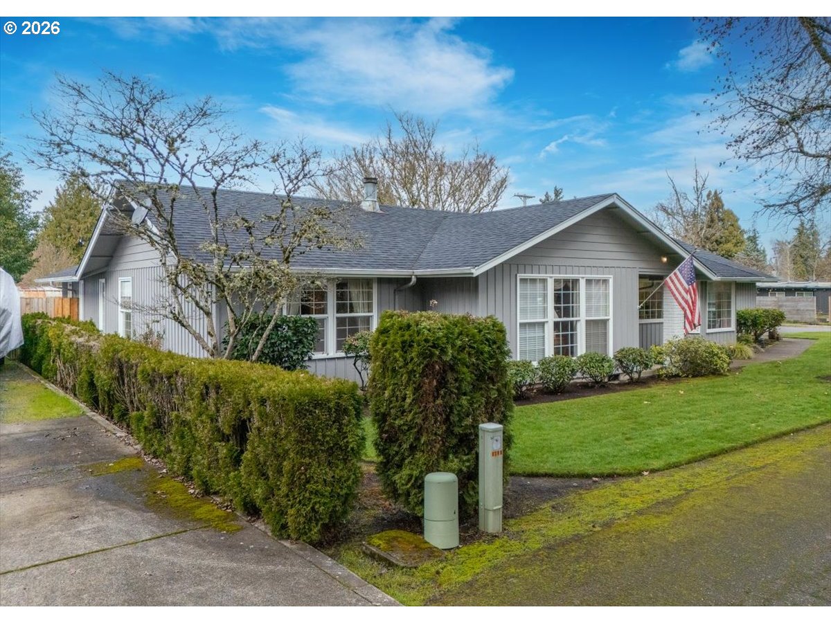 1376 Brickley Road Eugene, OR 97401 - Photo 4 of 48 a front view of a house with a garden