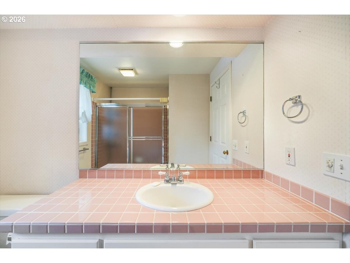 1376 Brickley Road Eugene, OR 97401 - Photo 43 of 48 a bathroom with a sink and a mirror